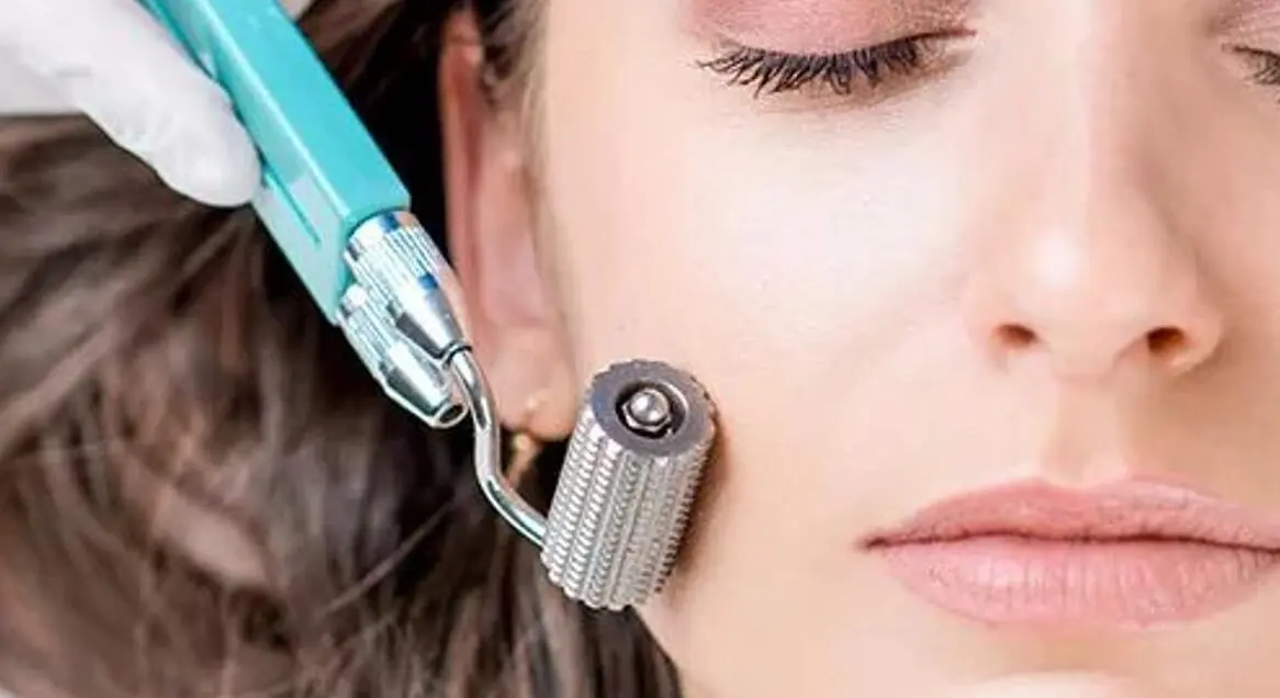 metal derma roller is rolling on your face